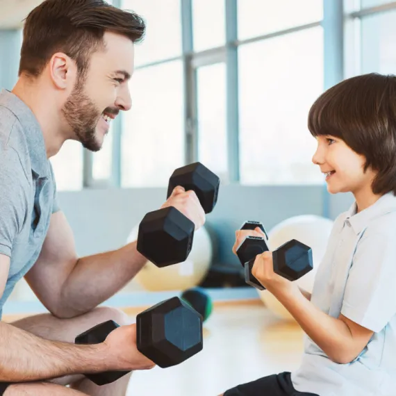A father and son lifting weights together.